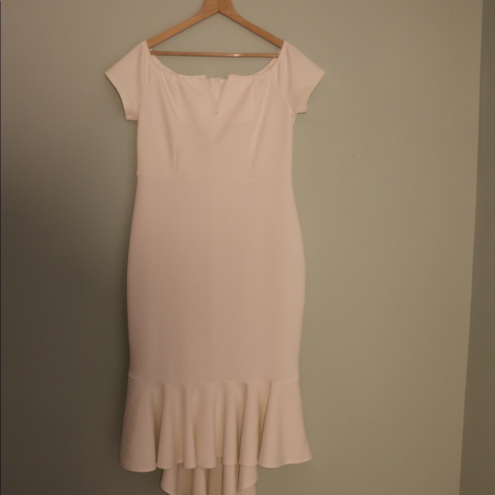 White dress with trail skirt.